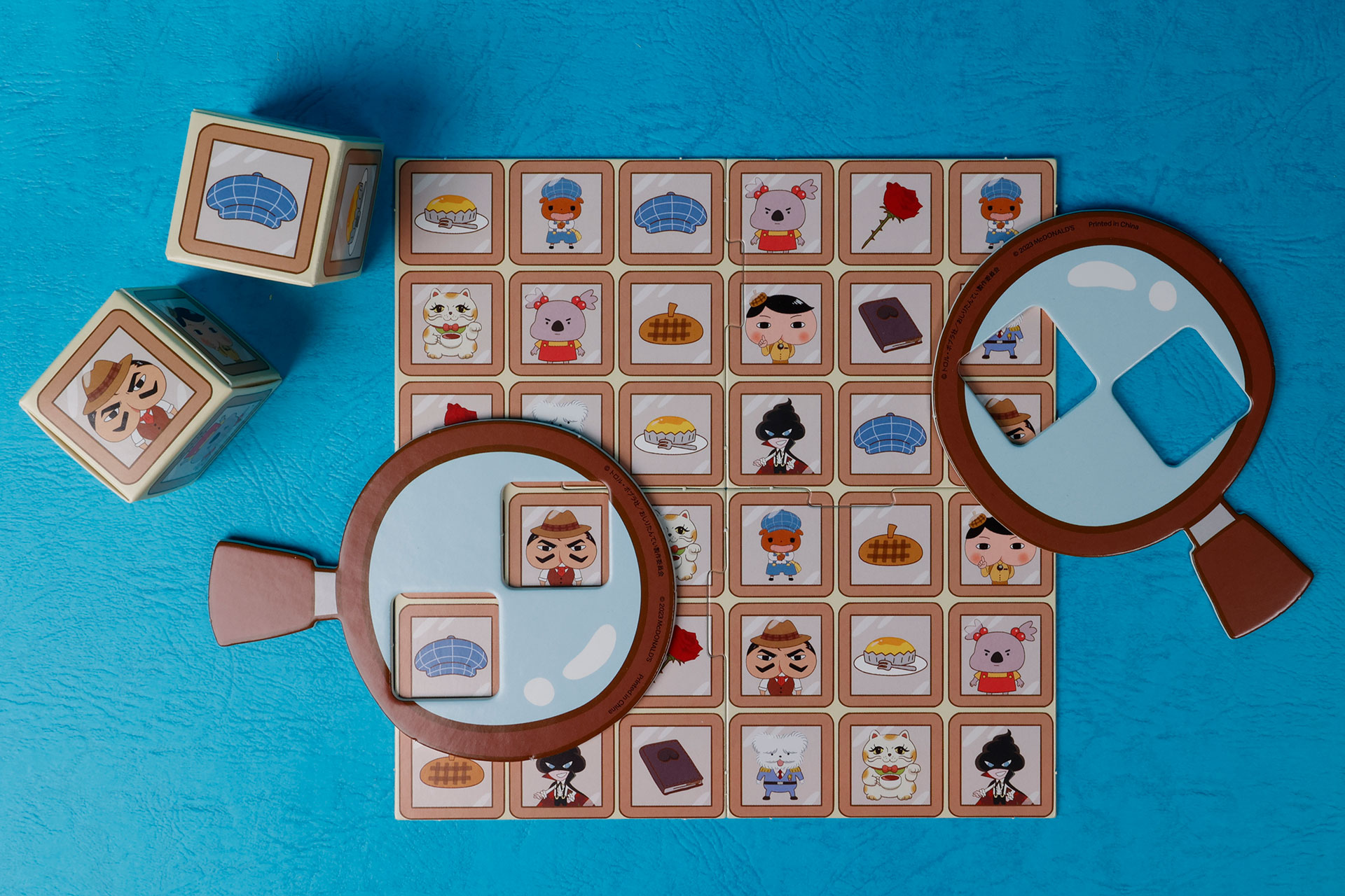 キューブを転がして出たふたつの図柄を、虫メガネを使って探しだそう！