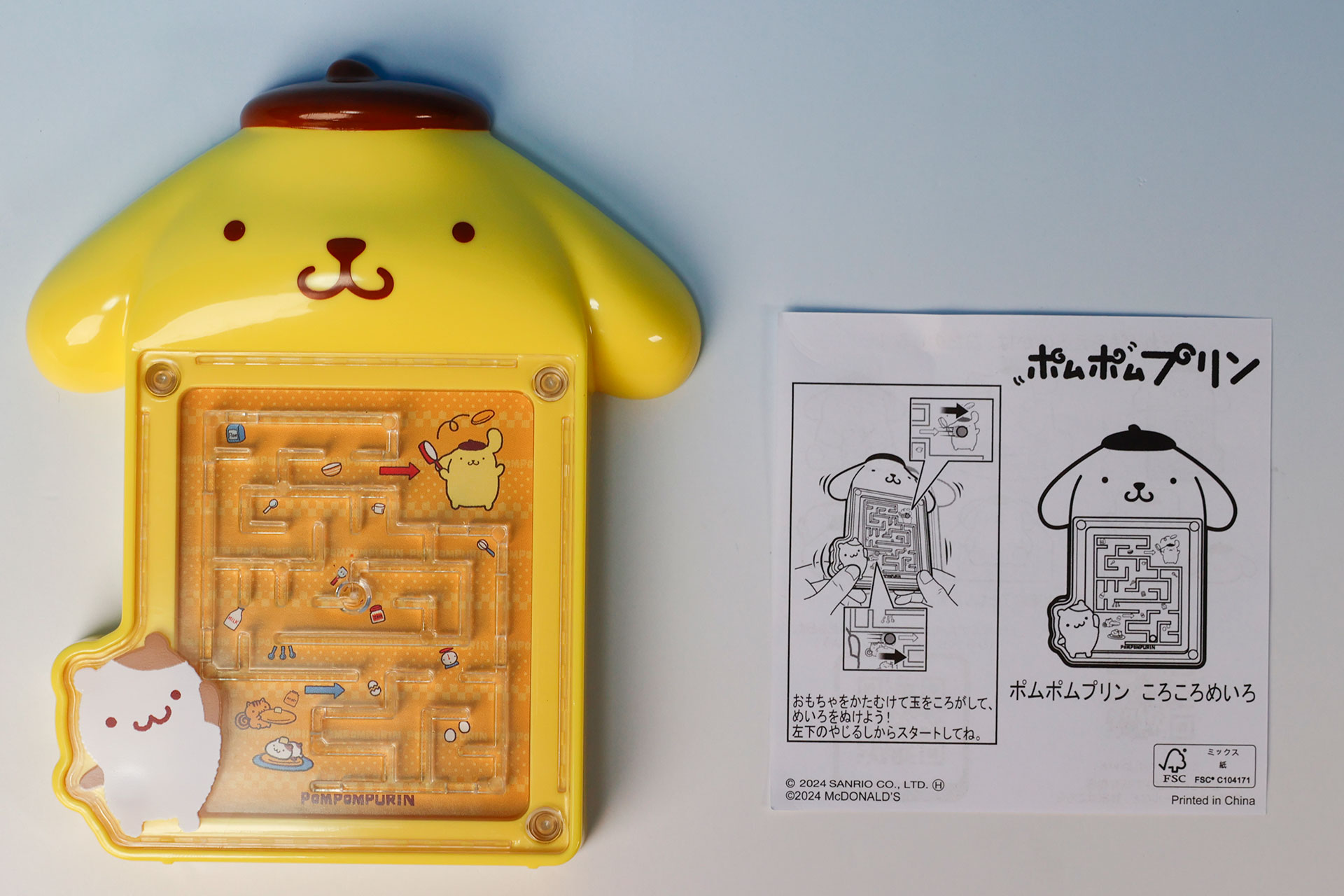 こちらが「ポムポムプリン ころころめいろ」のおもちゃ袋の中身だ