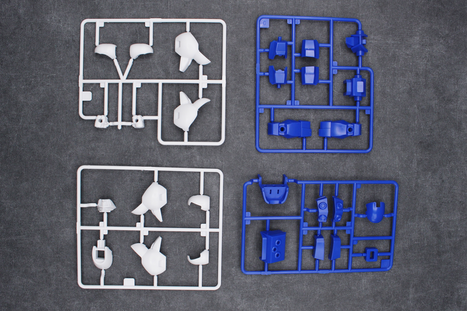「ブロックロス 龍神丸（魔神英雄伝ワタル）」の内容物。ランナーA～G、ブロックフレーム、ブロックの予備2個、シール