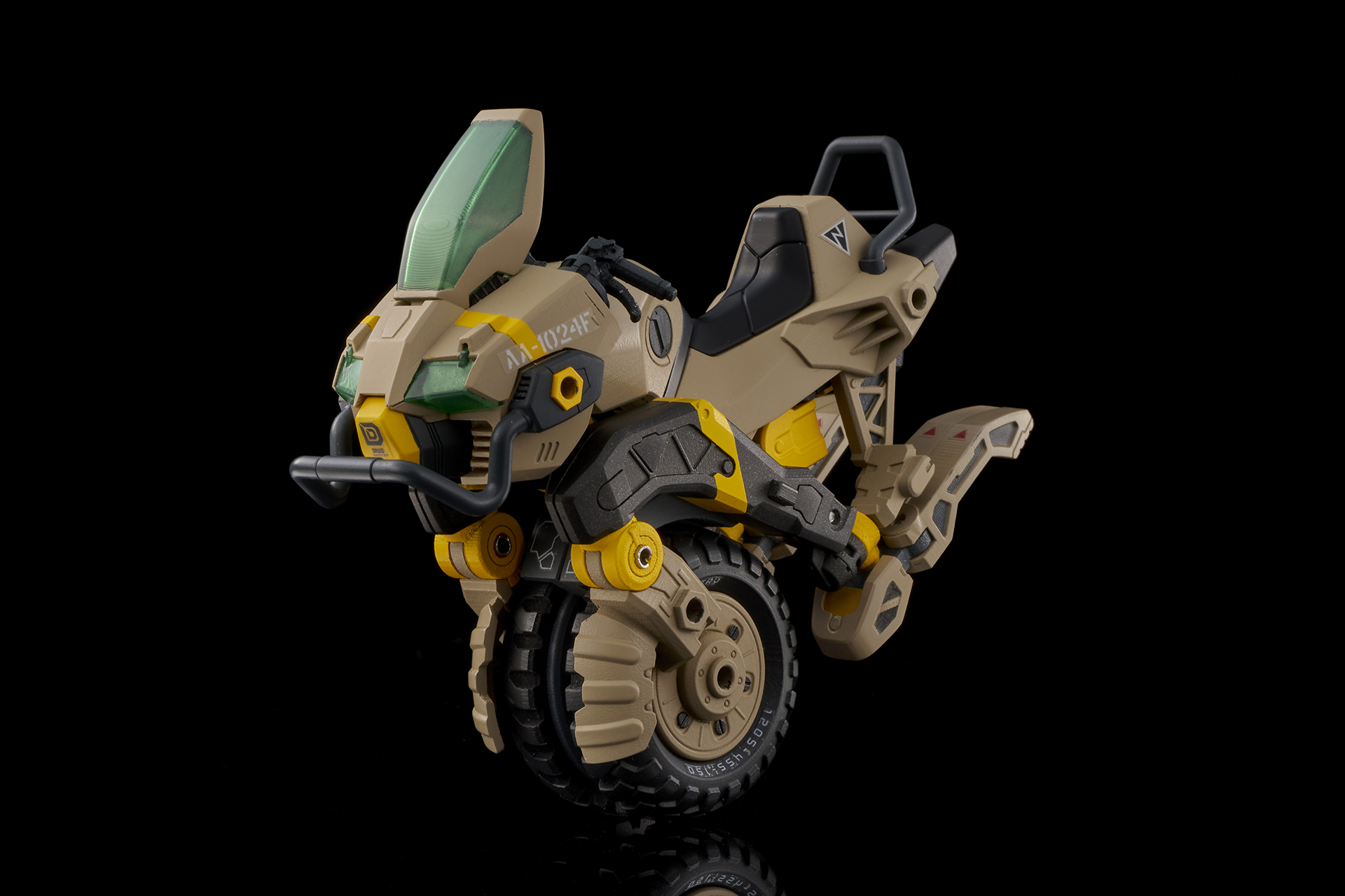 カーキ色のボディの一輪バイク。黄色の差し色が鮮やかだ