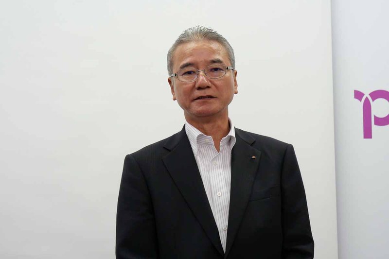 奄美群島でのキャッシュレス化の取り組みについて説明する、奄美大島信用金庫 専務理事の伊東寛久氏