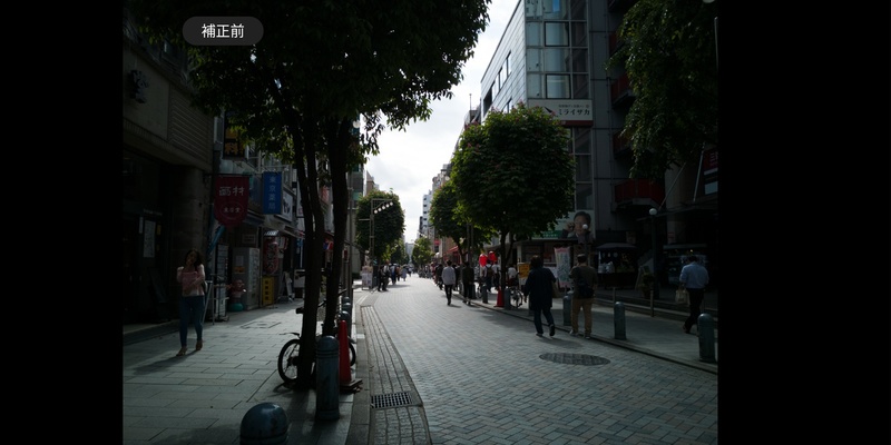 補正前のRAWデータ。ファーウェイのAIなども適用されていない、完全に無補正の画像だ。端末上で見ることが珍しい状態の画像でもある。逆光気味のせいか、街路樹や周囲が実際よりも暗く写っている