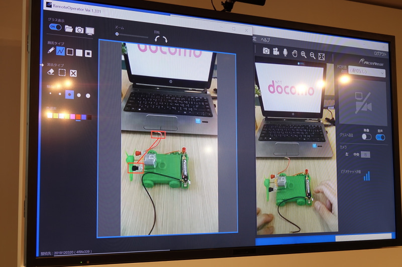 画面に赤枠を書き込んで指示を出す様子
