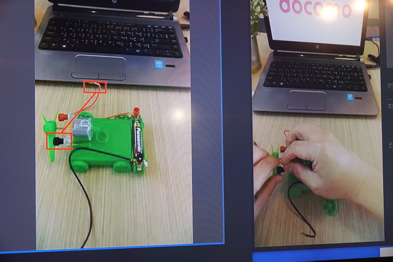 画面に赤枠を書き込んで指示を出す様子