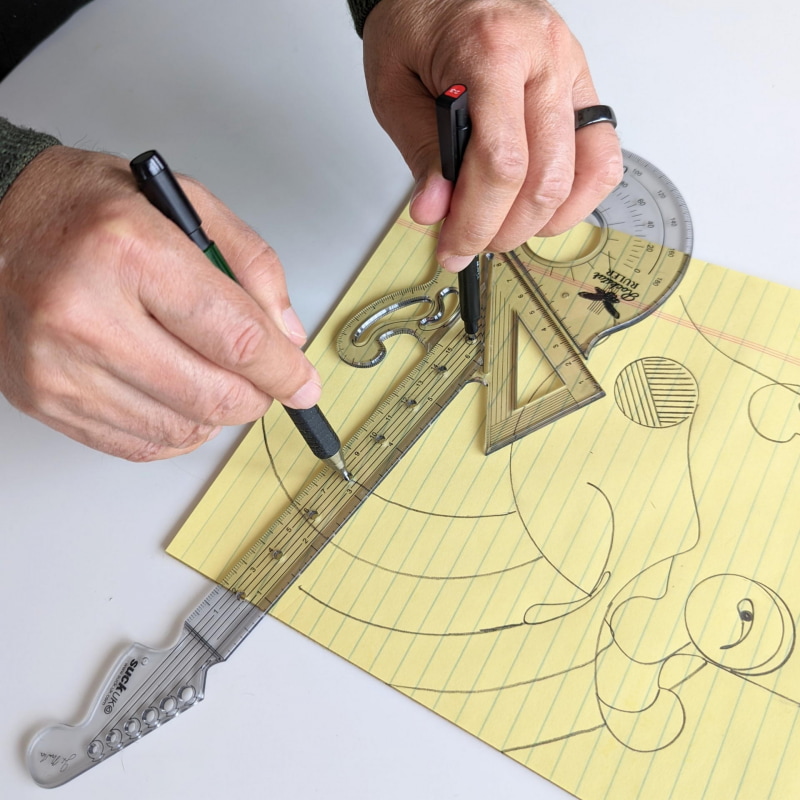 スティック消しゴムを軸にして鉛筆で円弧を描くのも簡単だ