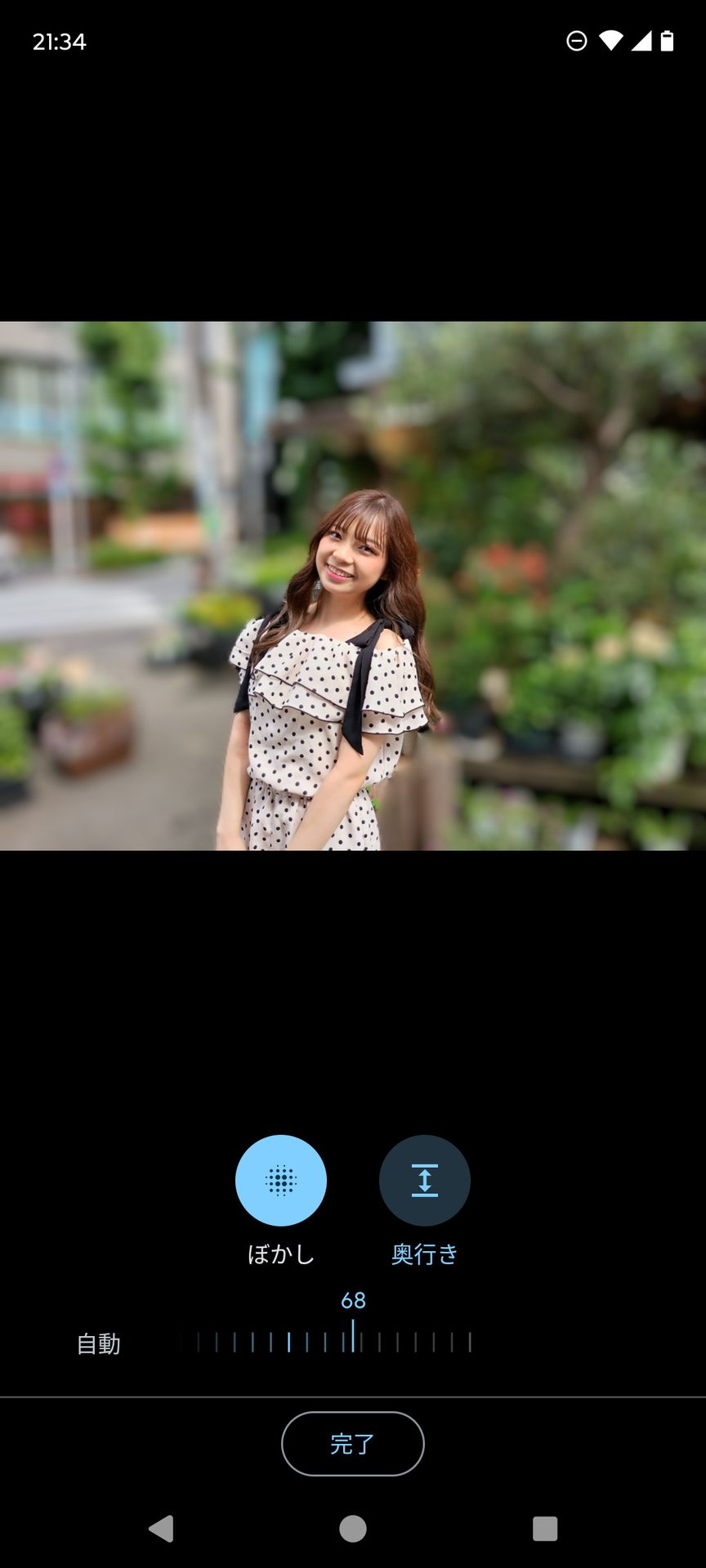 ［フォト］アプリの編集では、背景のぼけ具合いも調整できる