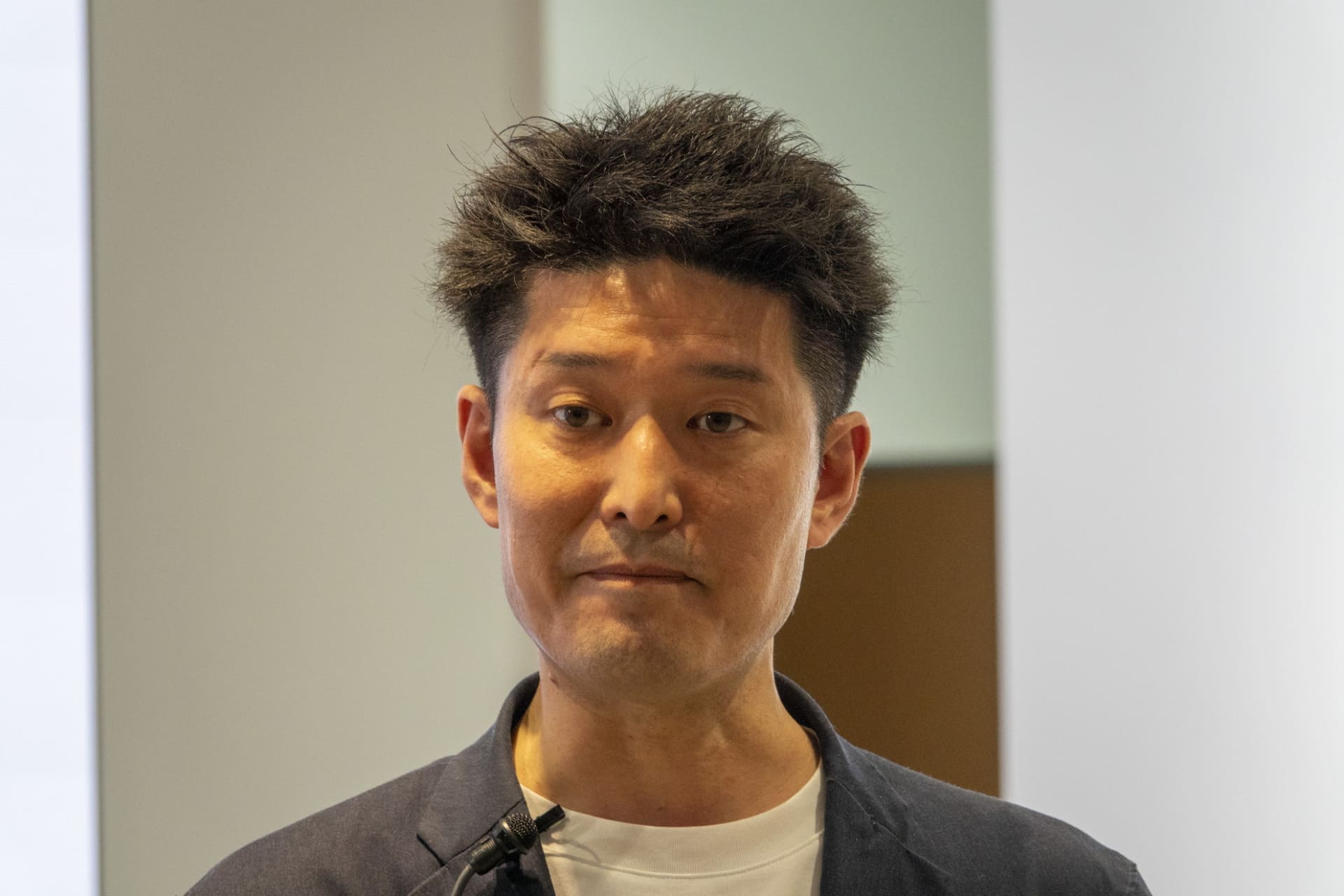 通信事業本部の本部長中江優晃氏