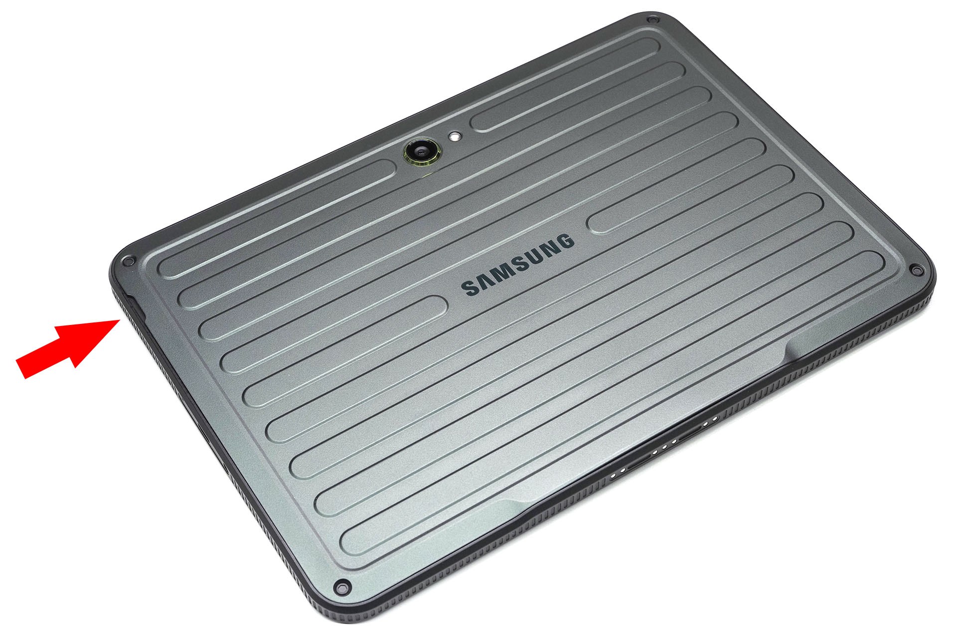 端末裏面のパネル。向かって左上に切り欠きがあり、ここを取っ掛かりとして裏面パネルを外せる。