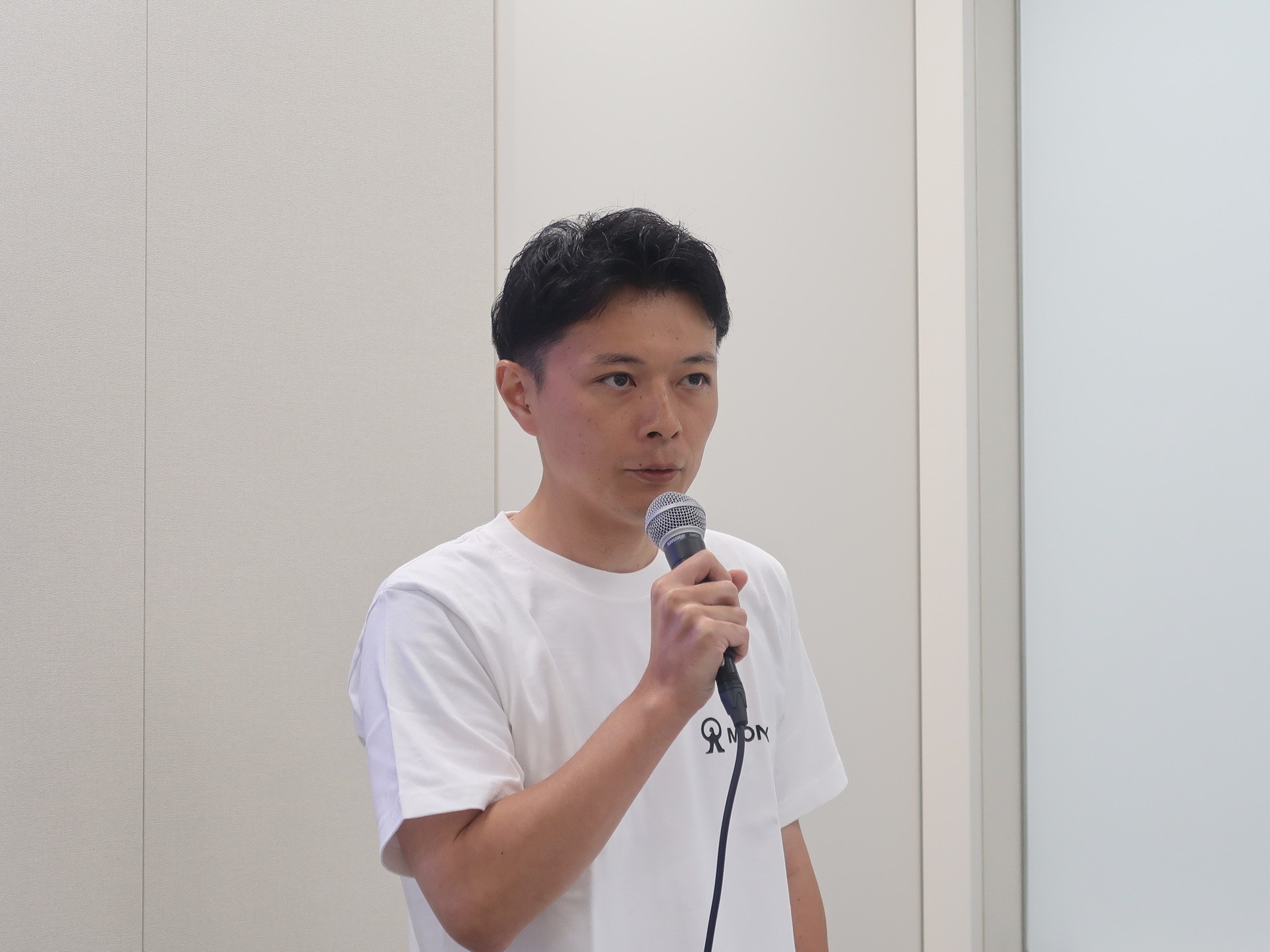 経過報告会で説明をおこなったマネックス証券 グロース戦略推進部 田邊湧志氏