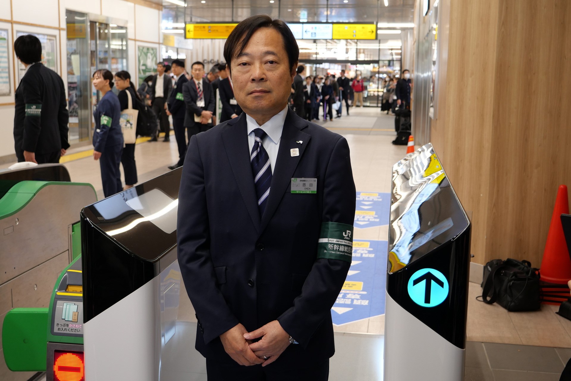 顔認証改札機の実証実験について説明する、JR東日本 新幹線統括本部 新幹線電気ネットワーク部 技術計画ユニットリーダーの恩田義行氏