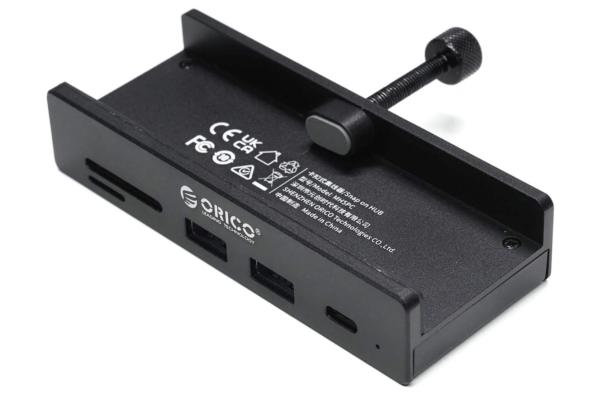 ORICO「MH5PC」はクランプでディスプレイ端やデスク端に固定できるUSBハブ。本体上部のクランプで固定し、固定できる対象の厚さは5～28mm。