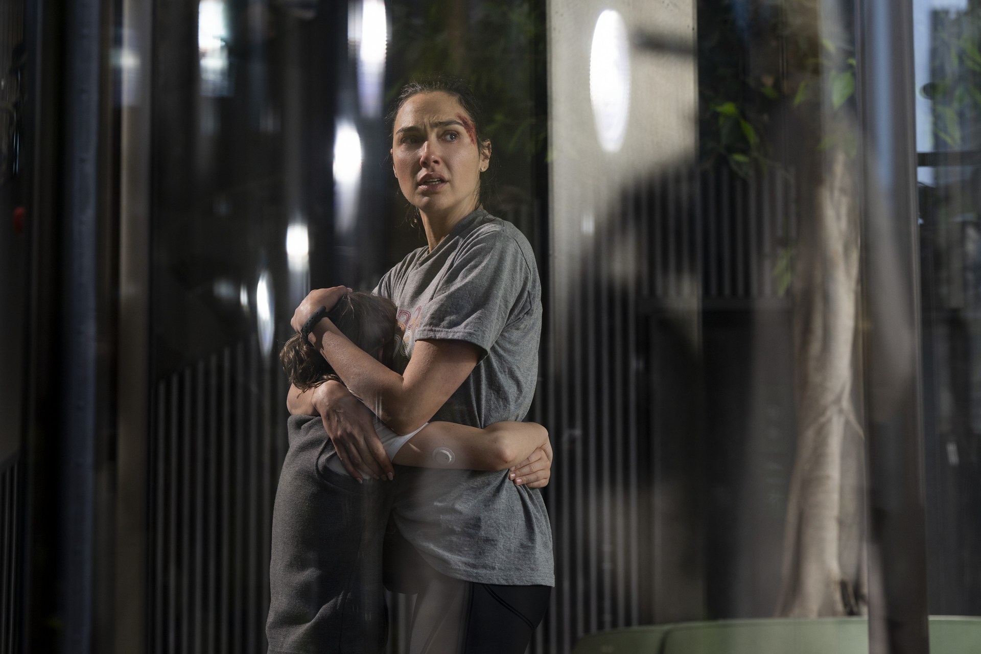 [L-R] Rory Wilmot as “Noah Marten” and Gal Gadot as "Maia Marten in the thriller suspense-action, THE RUNNER, from Amazon MGM Studios. Photo credit Amazon MGM Studios.