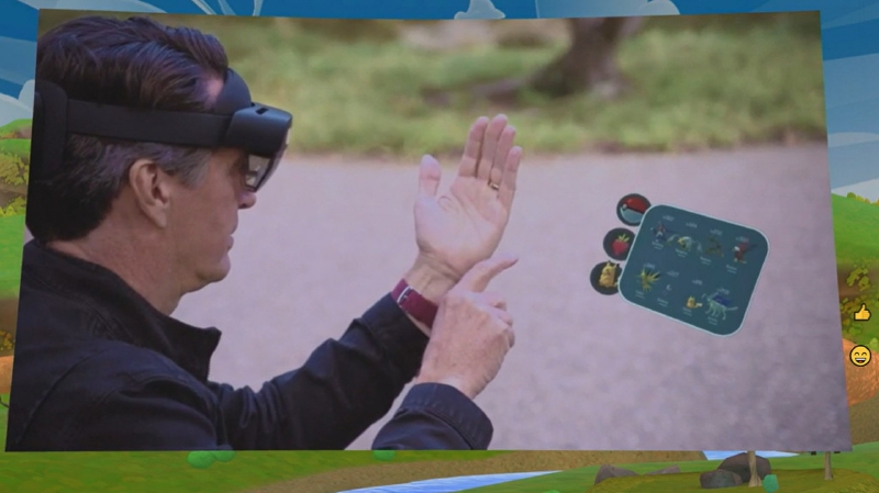 Pokémon GoのHololens用PoC版のデモ、Hololensを被ったまま街に出るかという議論はおいておくとして、印象的なデモであることは間違いない。公園にいるピカチュウに餌をあげることができる(Igniteの基調講演より筆者キャプチャ)