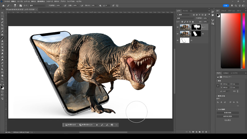 恐竜の不要な部分のレイヤーマスクを黒く塗り、右半分だけが恐竜がスマホから飛び出しているような演出をします