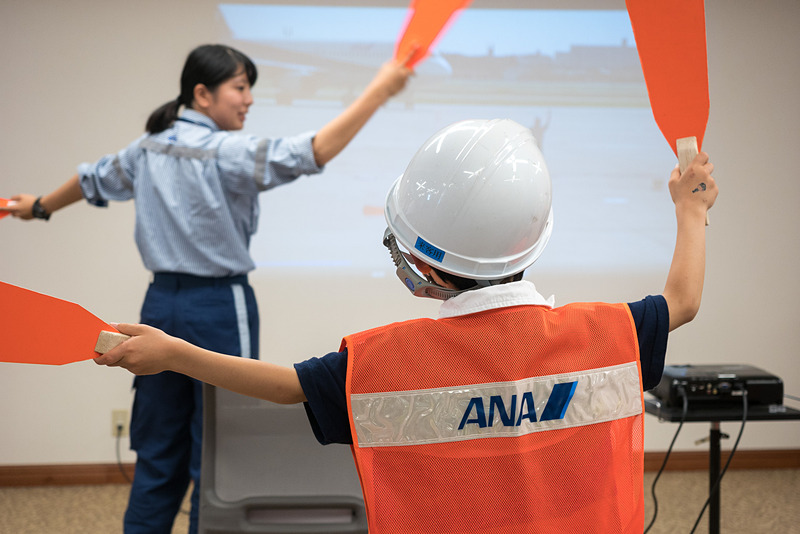 マーシャラー視点のビデオを使った体験コーナー。この整理券は随時配布しており、イラストがかわいいイラストボードで、次に体験できる整理券番号を告知するスタイル