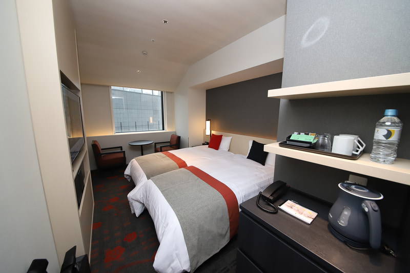 スタンダードツイン/スタンダードトリプルの部屋に分かれている（「梅」カラー）