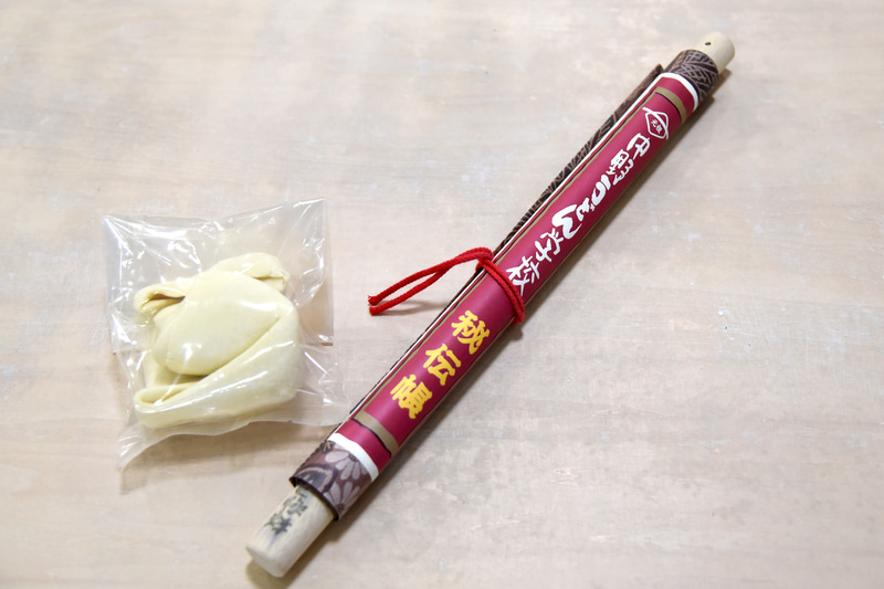 完成した団子と自宅で制作する際に使える麺棒と秘伝帳（卒業証書も含む）がもらえた