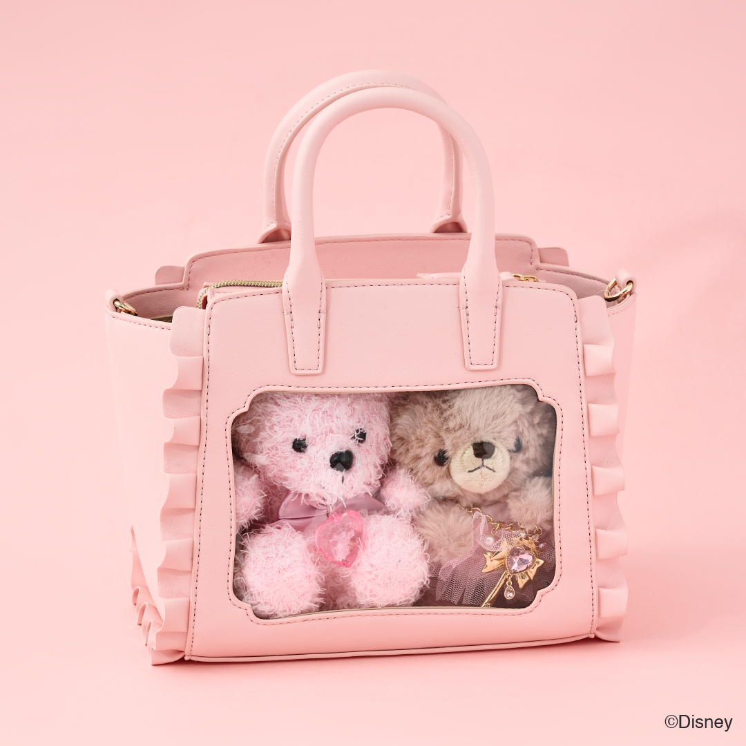 「オーロラ姫」はピンク。「眠れる森の美女」の世界観を楽しめる色合いに、バッグ正面の型押しデザインはオーロラ姫が語りかけるような姿