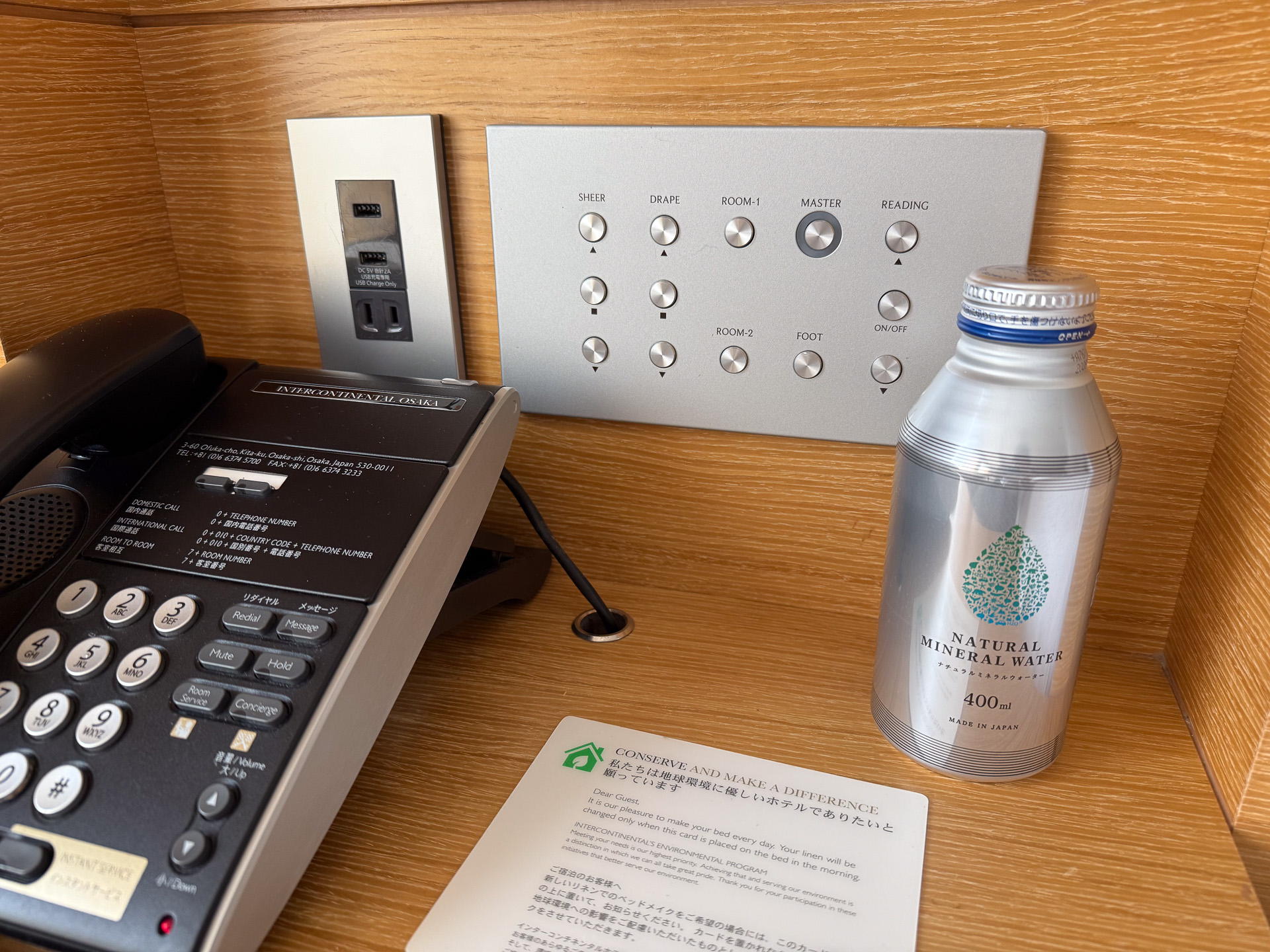 On both sides of the headboard, you'll find light controls, power outlets, and USB Type-A charging ports. In a move away from plastic, drinking water is provided in screw-cap aluminum cans.