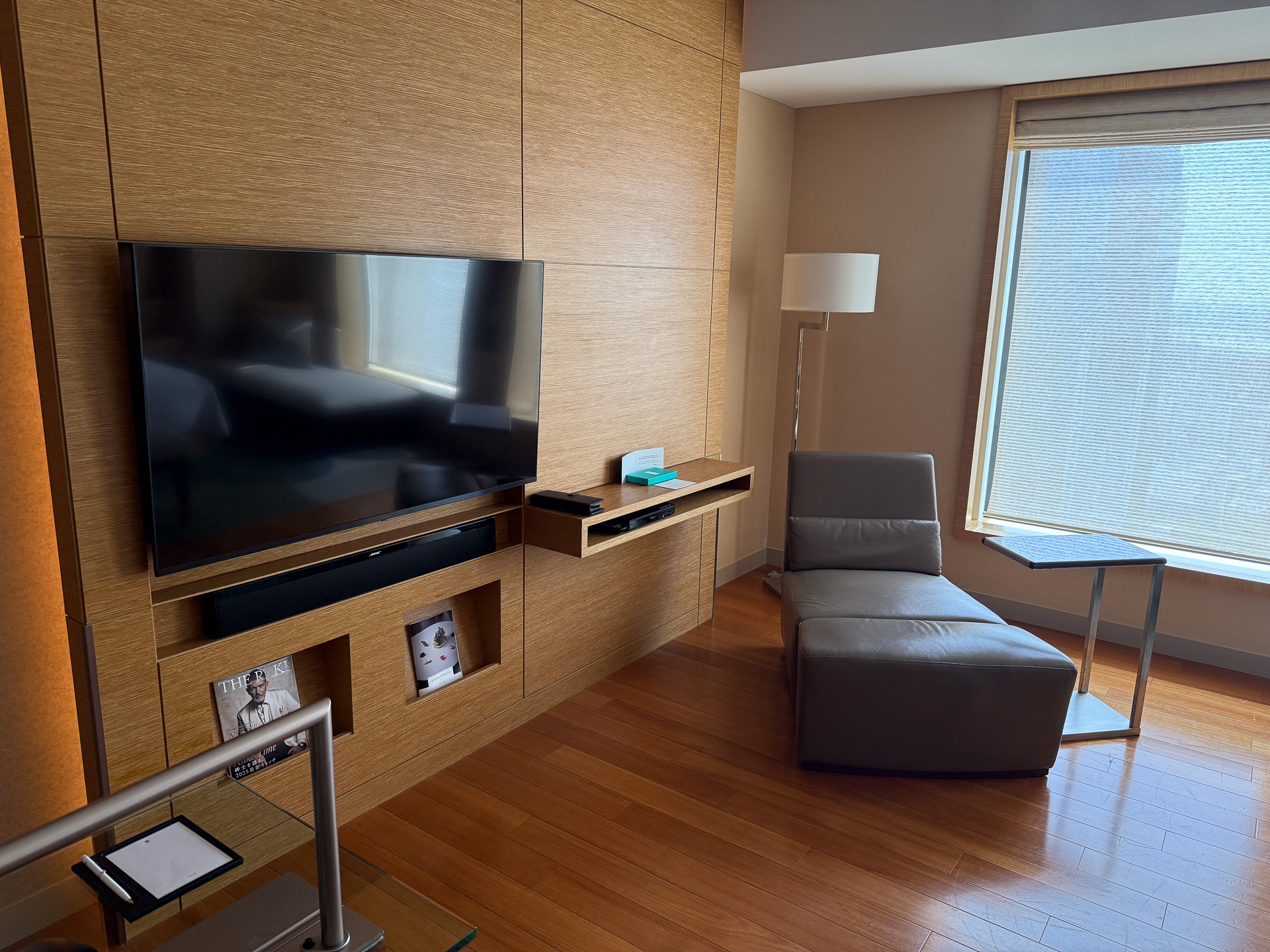 A 55-inch wall-mounted smart TV, complete with a soundbar.