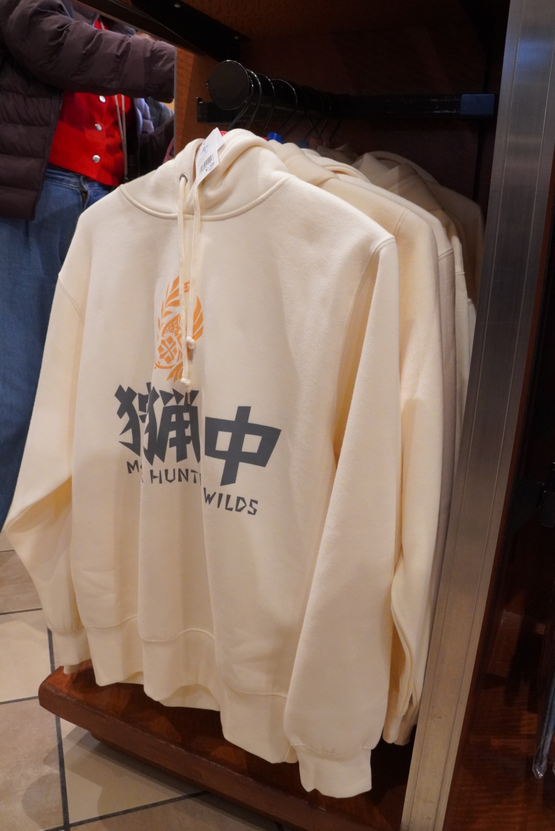 The hoodie is available in black and white.