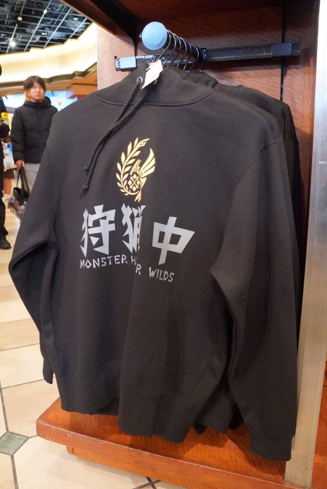 The hoodie is available in black and white.