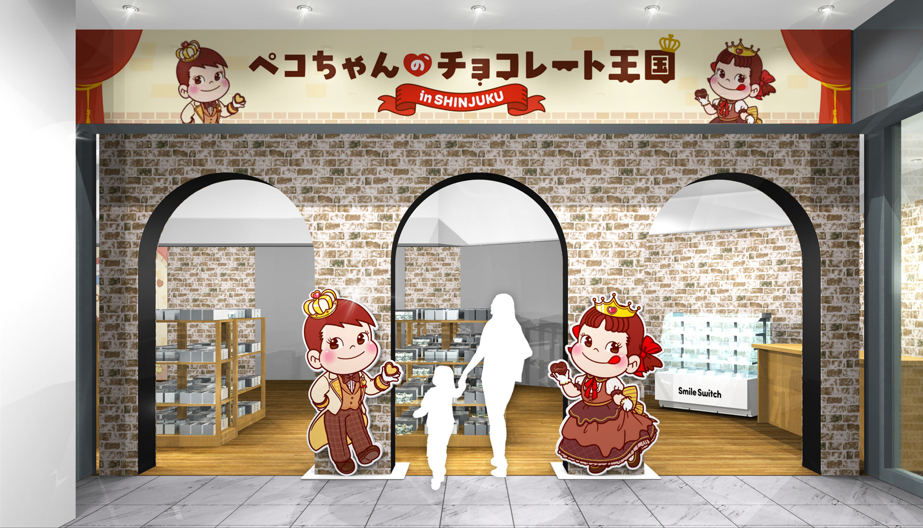 チョコレートのドレスを着たペコちゃん姫＆ポコちゃん王子のパネルが出迎えるイベント会場