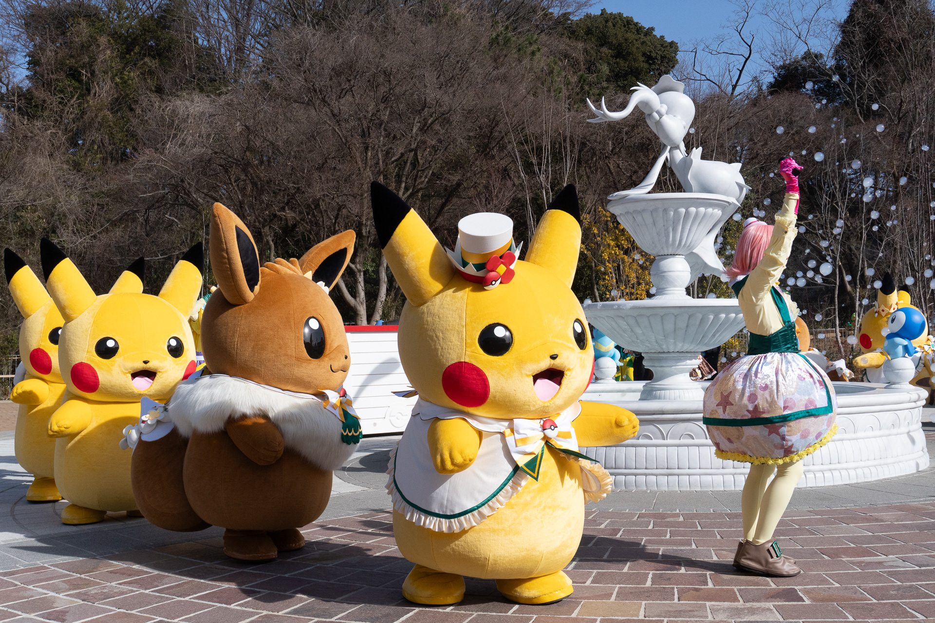 A massive group of Pikachu and Eevee toddles towards the crowd!