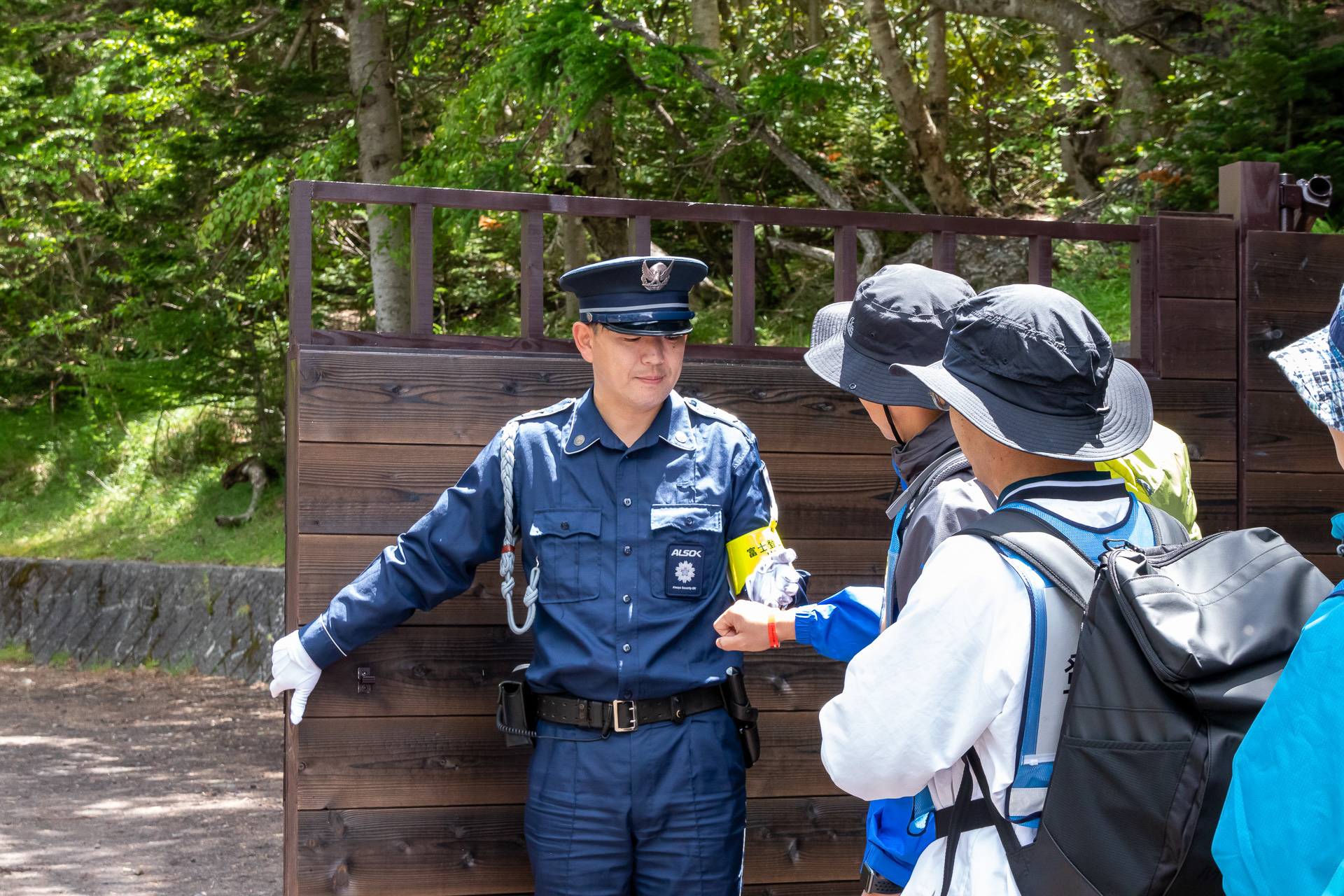 The gate at the Yoshida Trailhead. During the season, guards are stationed 24/7 to manage and regulate access. (Photo from the gate's installation in June 2024)