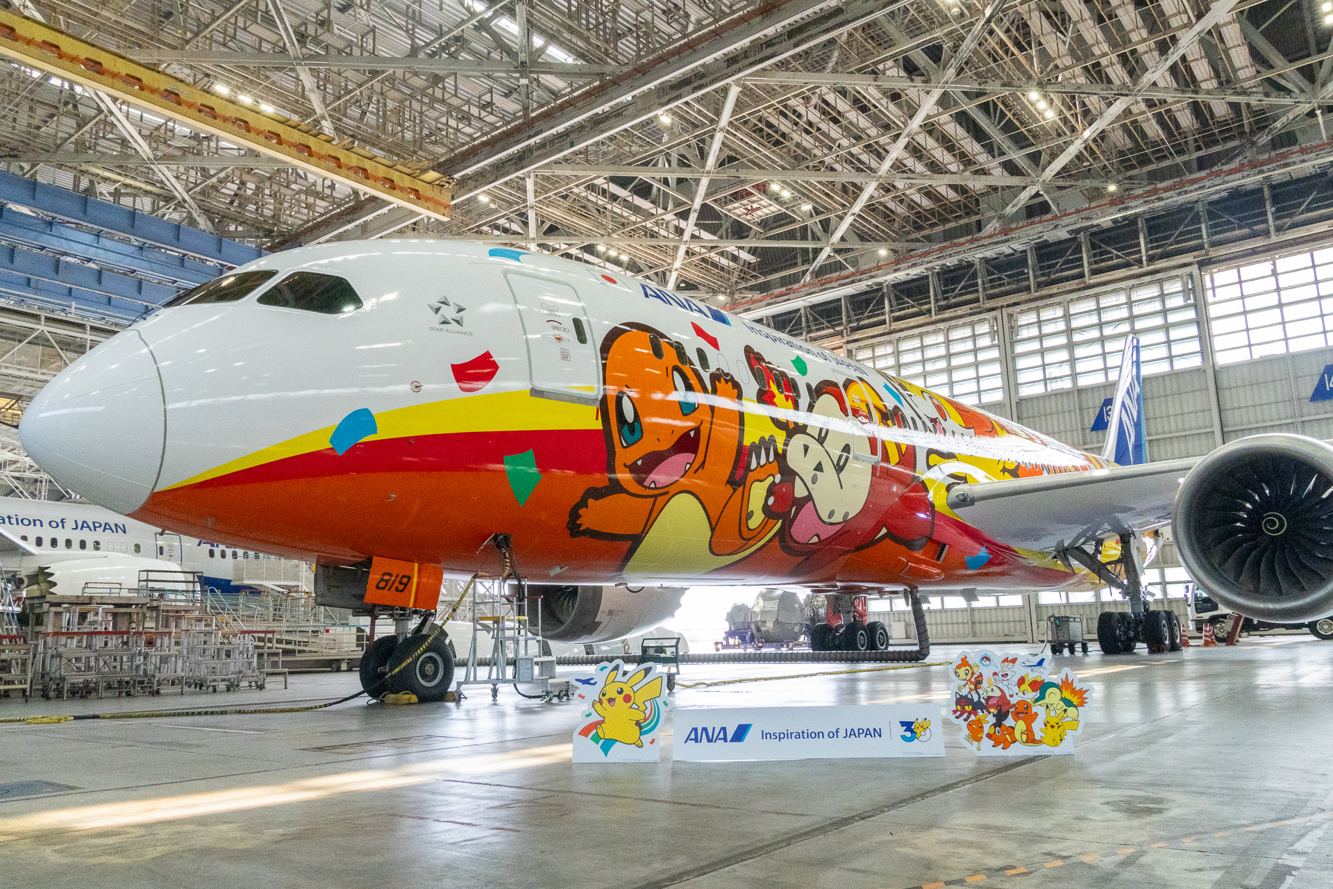 The "Pokémon Jet Red" is a Boeing 787-8 (registration: JA819A) configured for domestic flights.