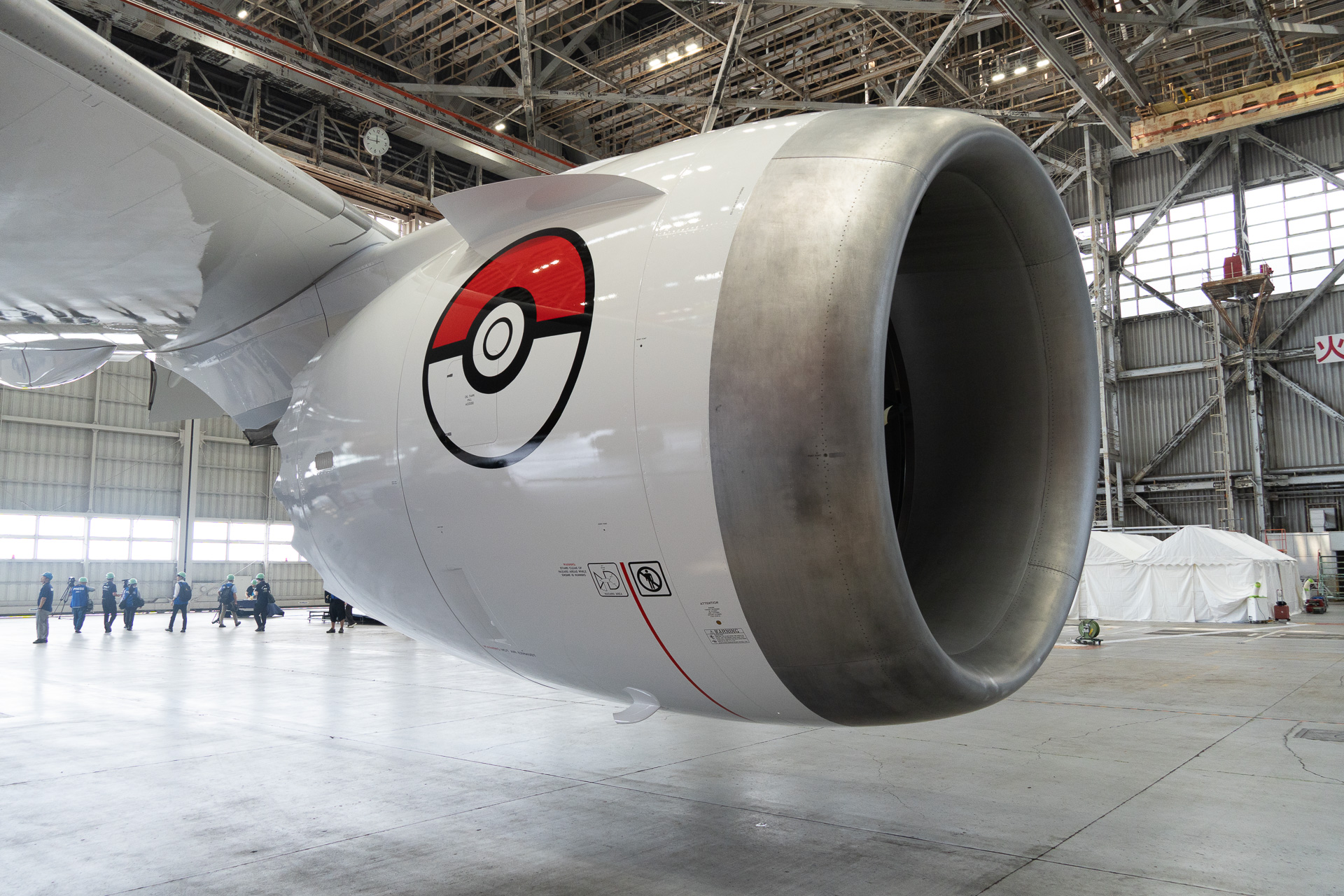 A Poké Ball is featured on the other side of the engine cowling, visible to passengers.