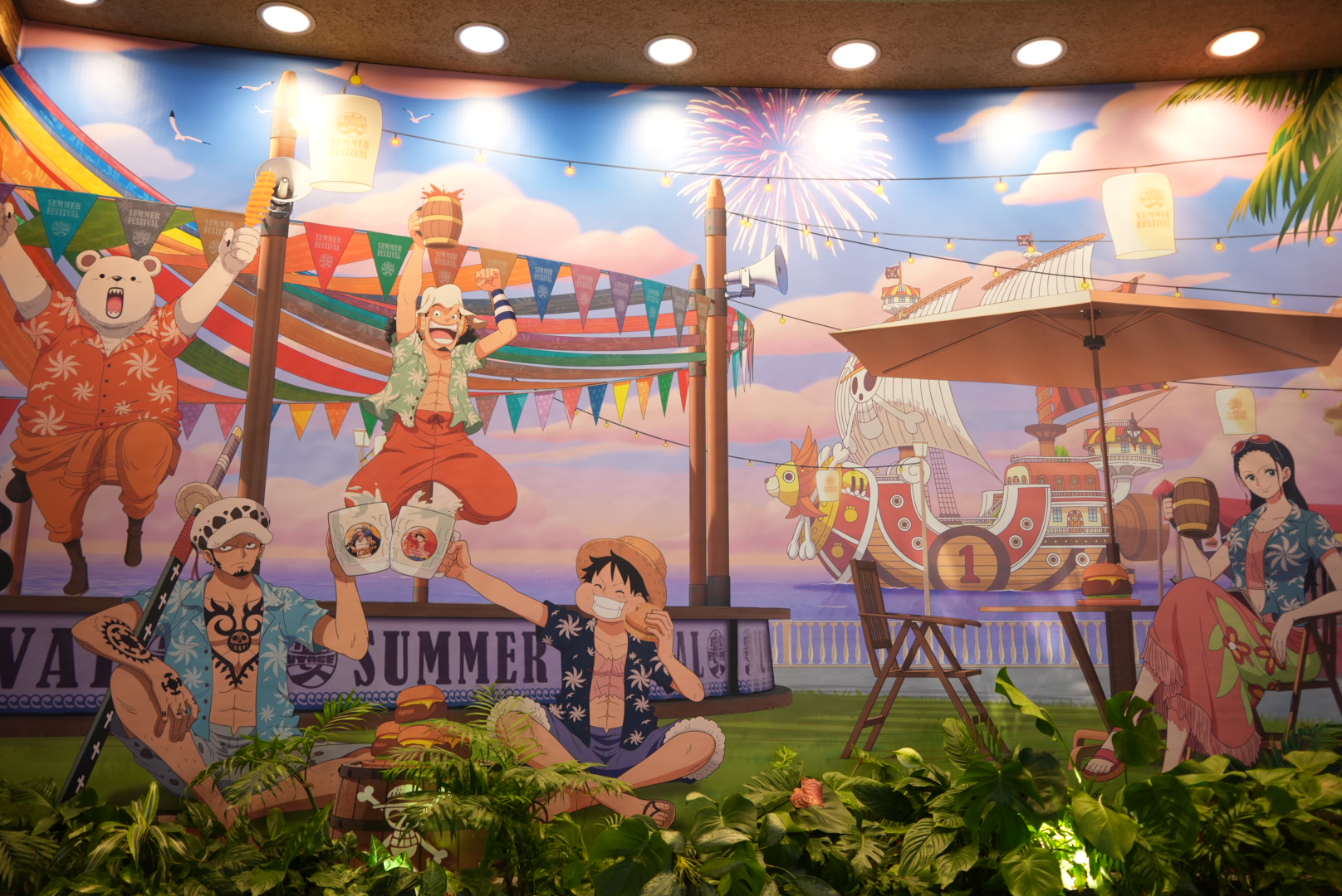 The limited-time "Straw Hat Crew's Banquet Restaurant" at USJ. The interior is designed to look like a festive banquet where the Straw Hat Crew and the Heart Pirates are having a wild celebration.
