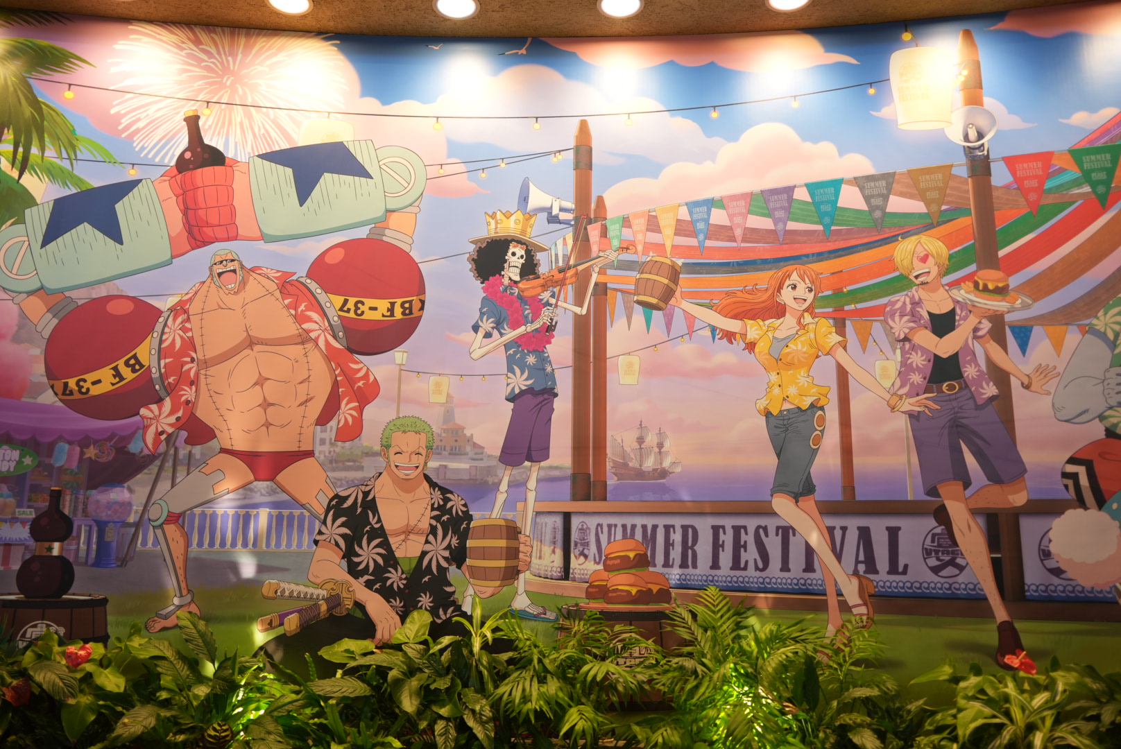 The limited-time "Straw Hat Crew's Banquet Restaurant" at USJ. The interior is designed to look like a festive banquet where the Straw Hat Crew and the Heart Pirates are having a wild celebration.