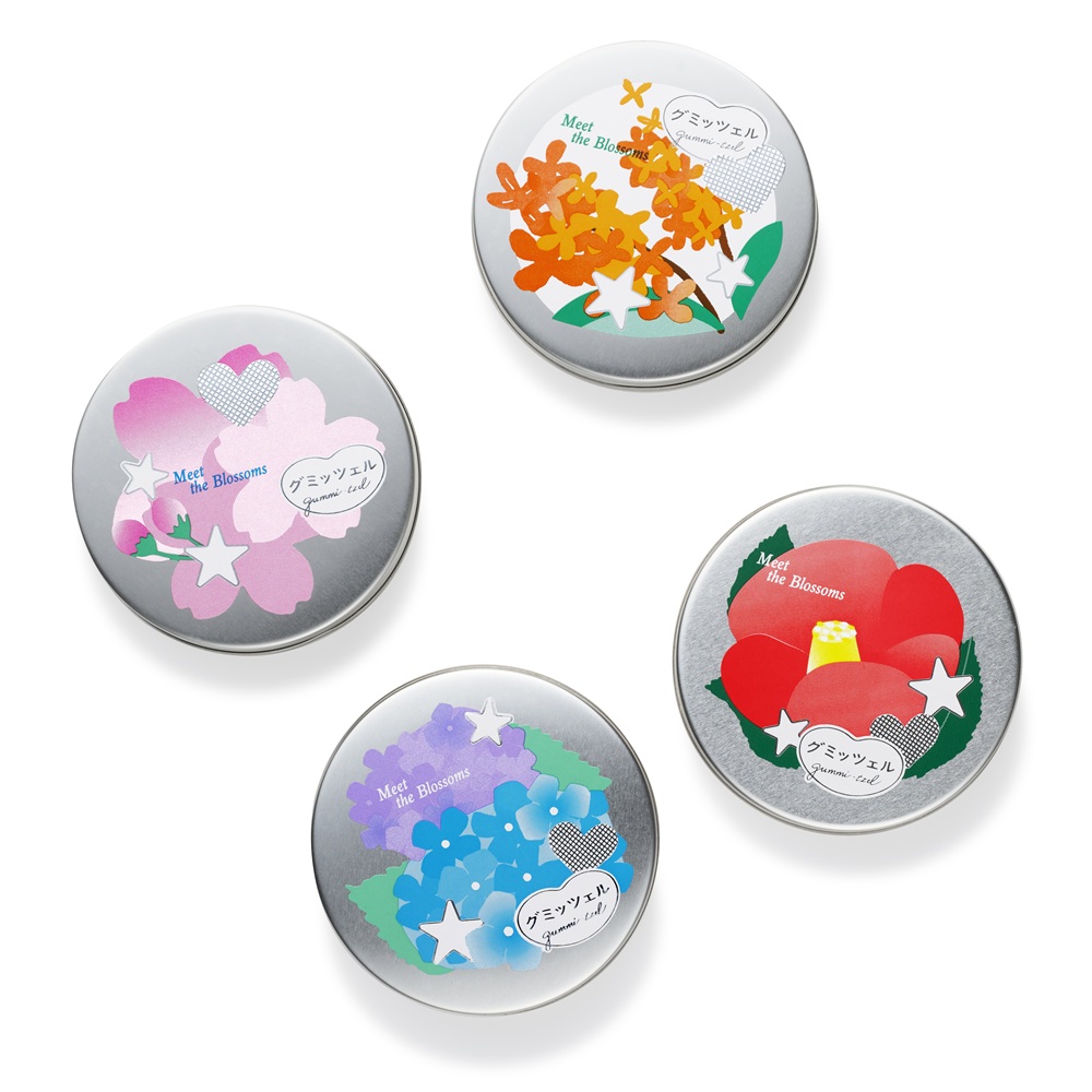 旅と日本の四季の花々をイメージした東京駅限定のミニ缶「はなたびグミッツェル」（45g 850円）。缶デザインは4種類（サクラ、アジサイ、キンモクセイ、ツバキ）で、いずれも3種フレーバー入り（ピーチ味、グレープフルーツ味、ソーダ味）