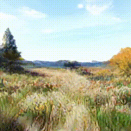 「チューリップや菜の花、色とりどりの花が果てしなく続く畑を埋め尽くし、まるでパッチワークのようにカラフルに彩る。朝の柔らかな光が花びらを透かし、淡いグラデーションが映える。風に揺れる花々をスローモーションで捉え、花びらが優雅に舞う姿を映画のような演出で撮影。背景には遠くに連なる山並みや青い空、浮かぶ白い雲が立体感を引き立てる。」というプロンプトで生成された動画